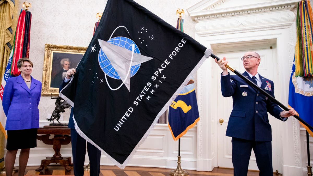 Trump is presented the Space Force flag