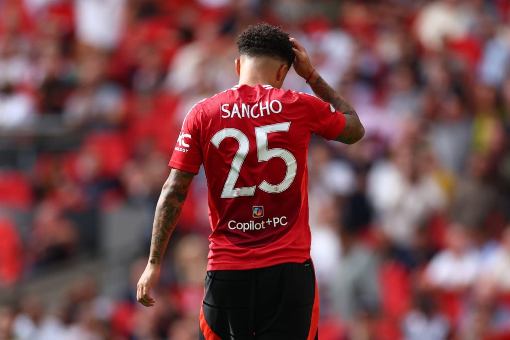 Jadon Sancho walks off after missing a penalty for Manchester United