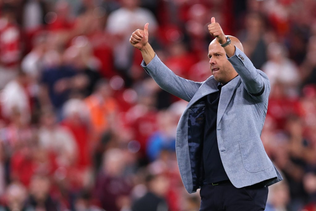 Arne Slot gestures to the fans after Liverpool's win over Bournemouth in the Premier League