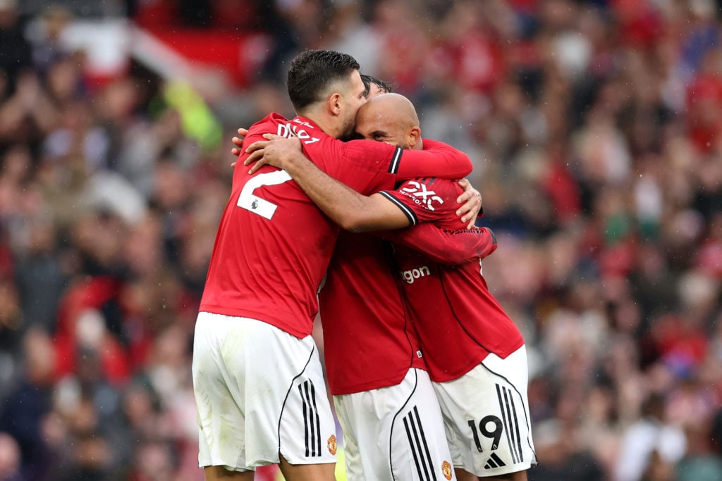 Diogo Dalot, Bruno Fernandes and Bryan Mbeumo celebrate the victory following the Premier League match between Manchester United and Burnley at Old Trafford in 2025 in Manchester, England.