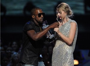 NEW YORK - SEPTEMBER 13:  Kanye West (L) jumps onstage after Taylor Swift (C) won the 