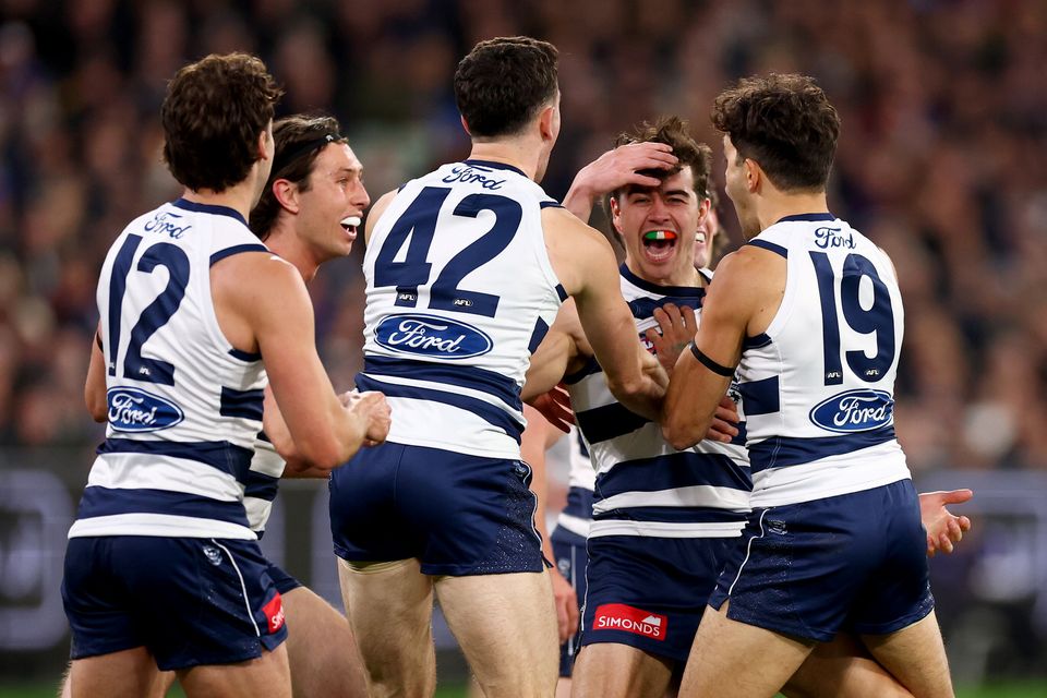 Oisín Mullin of the Cats is congratulated by teammates after kicking his first goal during the AFL Qualifying Final match against Brisbane Lions at Melbourne Cricket Ground on September 05, 2025 in Melbourne, Australia. (Photo by Daniel Pockett/Getty Images)