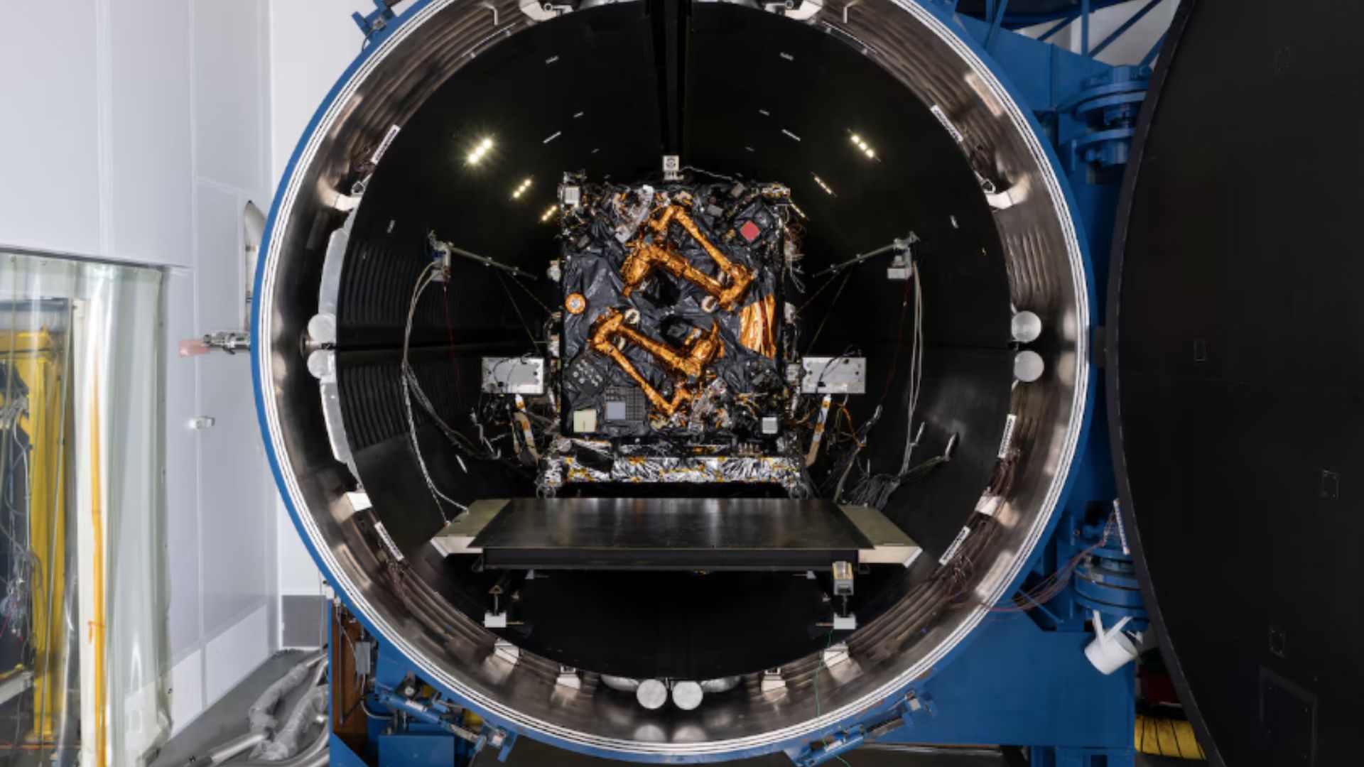 The Robotic Servicing of Geosynchronous Satellites (RSGS) payload integrated with the Northrop Grumman Mission Robotics Vehicle (MRV) spacecraft bus sits in the cryogenic thermal vacuum chamber