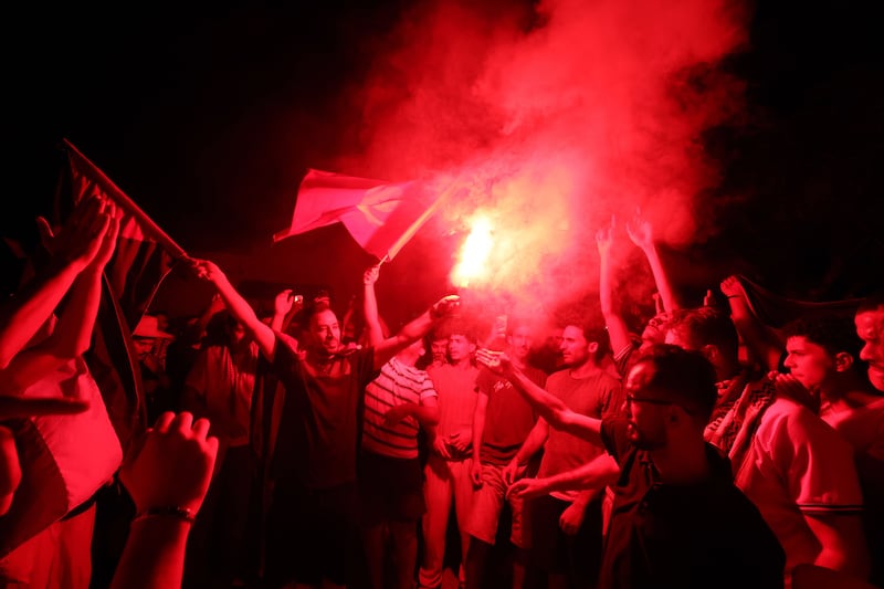 Pro-Palestinian supporters light up flares as they protest an apparent attack on a humanitarian ship at the port of Sidi Bou Said, Tunisia. Photograph: EPA