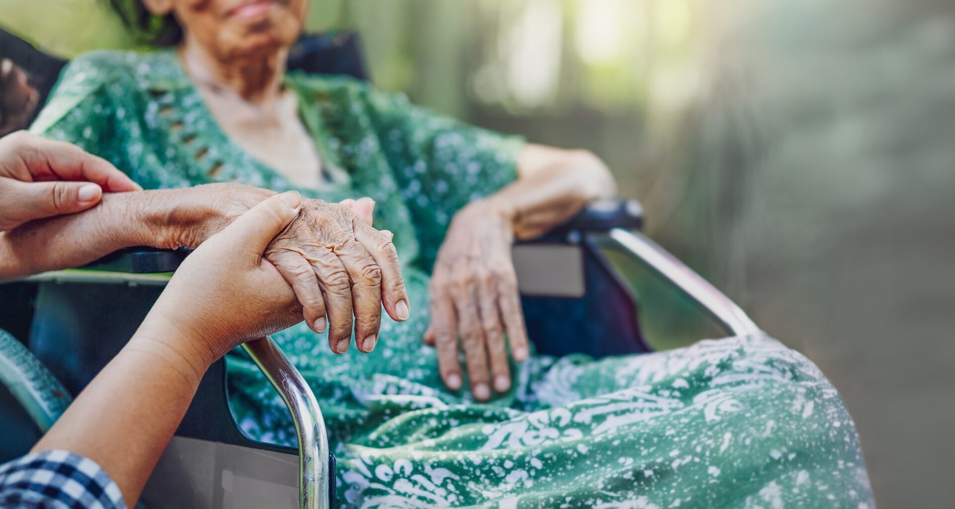 Elderly asian woman on wheelchair at home with daughter take care