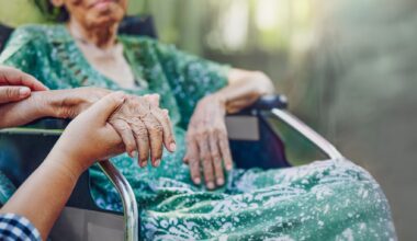 Elderly asian woman on wheelchair at home with daughter take care