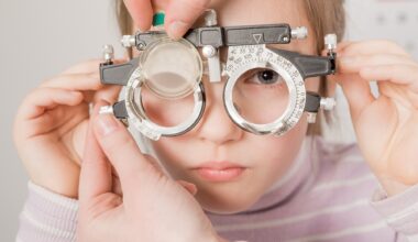 young girl smiling while undergoing eye test