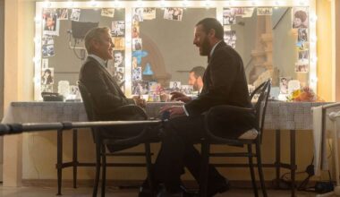 George Clooney as Jay Kelly and Adam Sandler as Ron Sukenick share a scene on the set of Jay Kelly, directed by Noah Baumbach. Photo by Peter Mountain, Netflix (2025).
