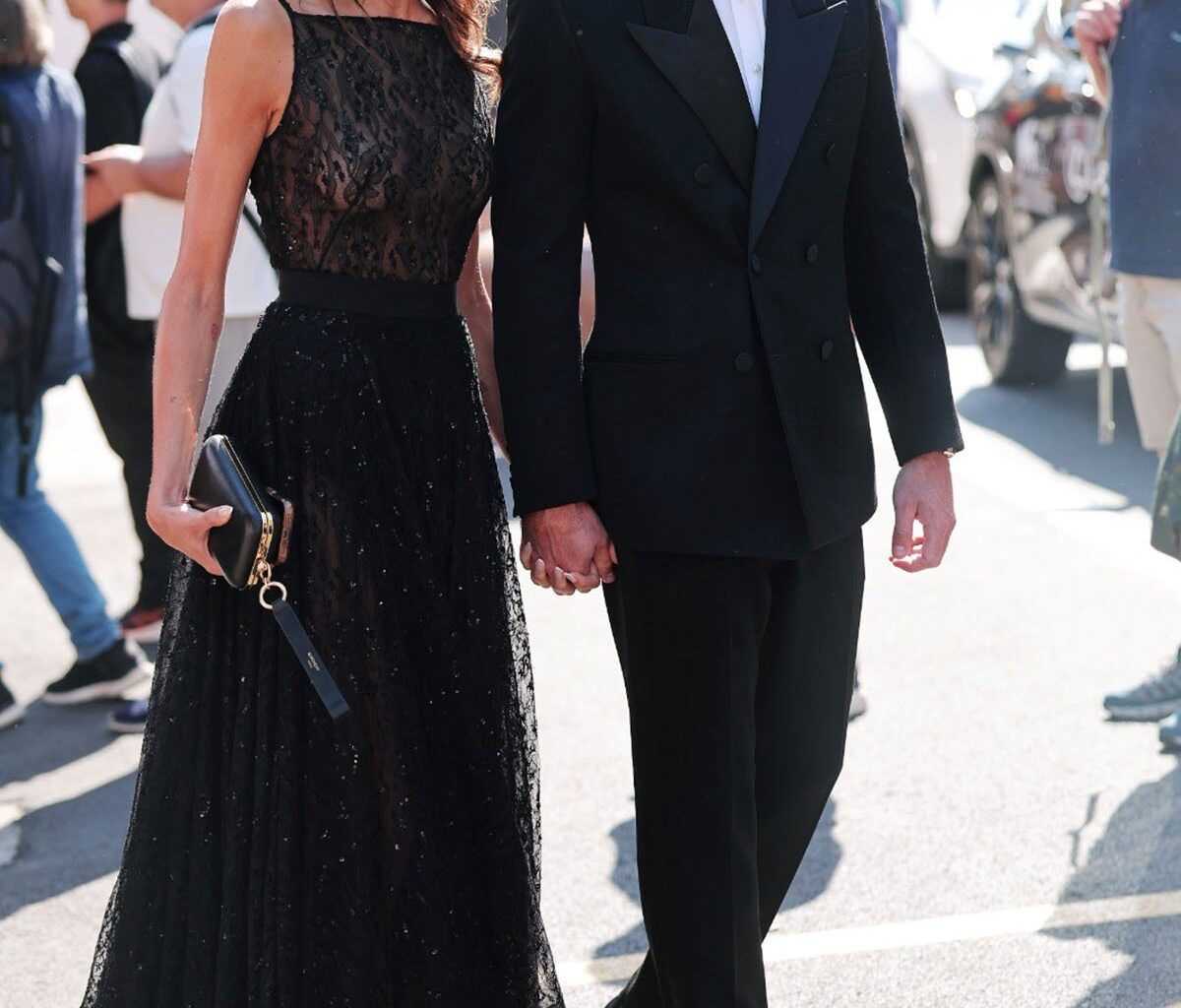 Kaia Gerber in Givenchy black lace dress Venice Film Festival with Lewis Pullman in Saint Laurent