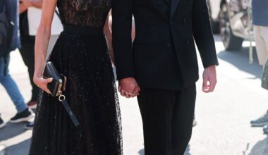 Kaia Gerber in Givenchy black lace dress Venice Film Festival with Lewis Pullman in Saint Laurent