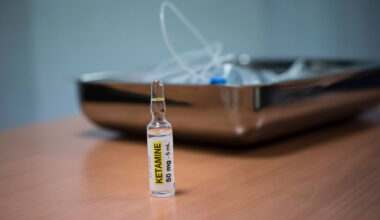 Ketamine in foreground with an IV tube in background.