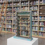 A sculpture of a window in front of a tall bookshelf with a stepladder.
