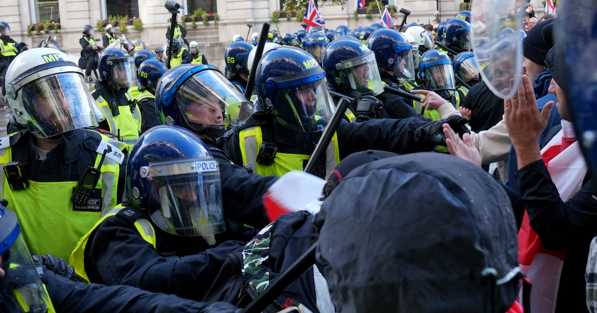 Police officers attacked at London protest led by far-right activist Tommy Robinson – The Irish Times
