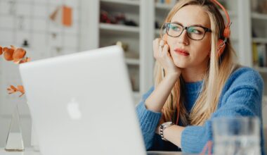 Woman sitting at laptop perplexed