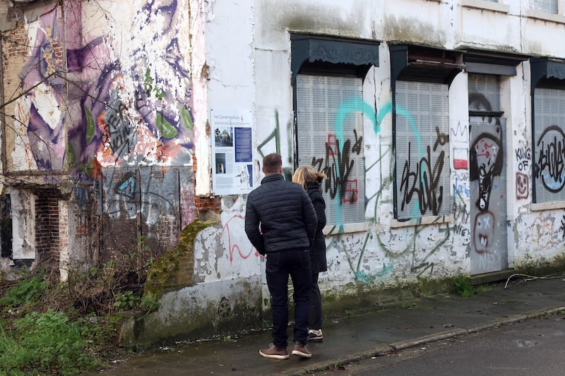 People in Doel, perhaps wondering how to catch the soul of the place. Photograph: François Walschaerts/AFP via Getty Images