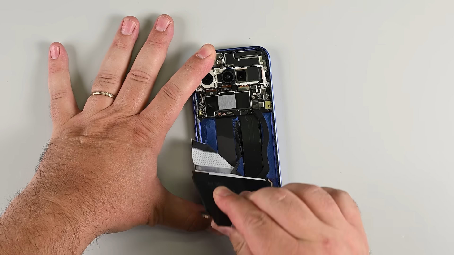 Pixel 10 iFixit Teardown Battery removal with plastic pull tab (1)