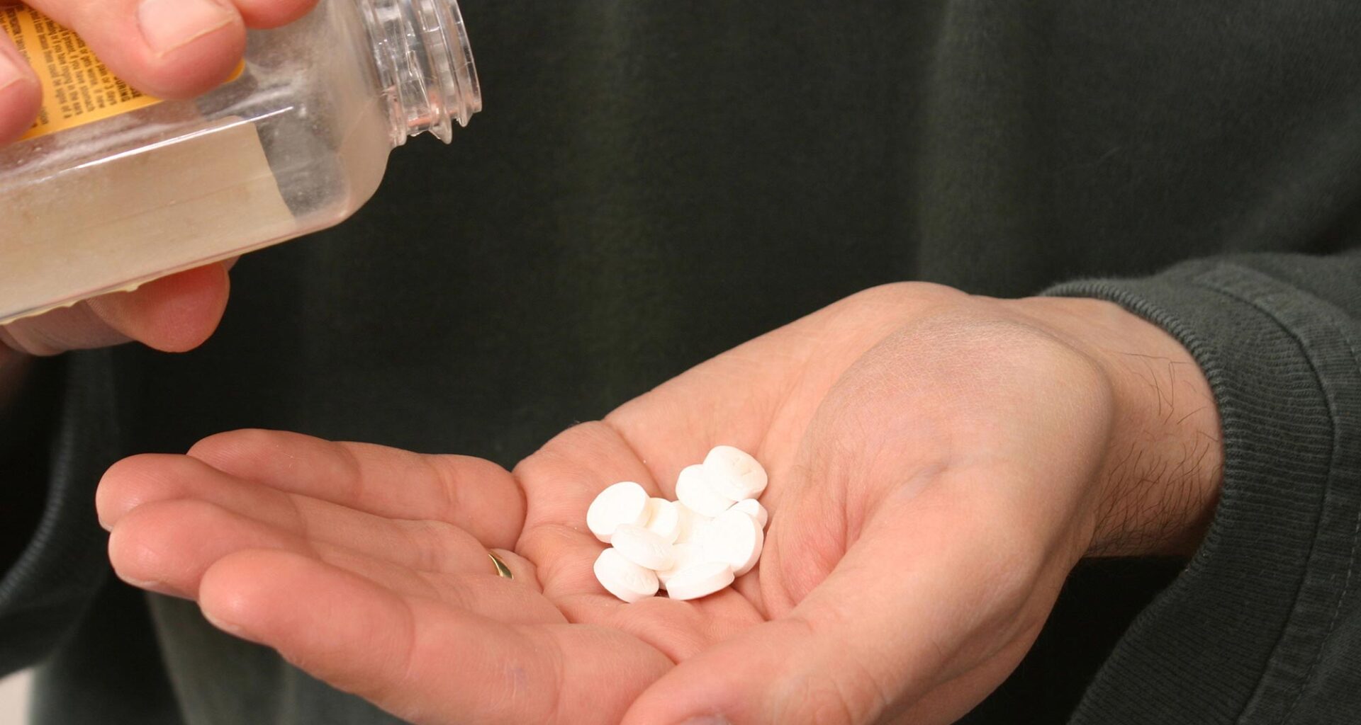 Pouring Aspirin Tablets