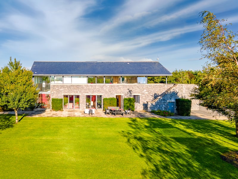 The house is set over two floors and clad in stone