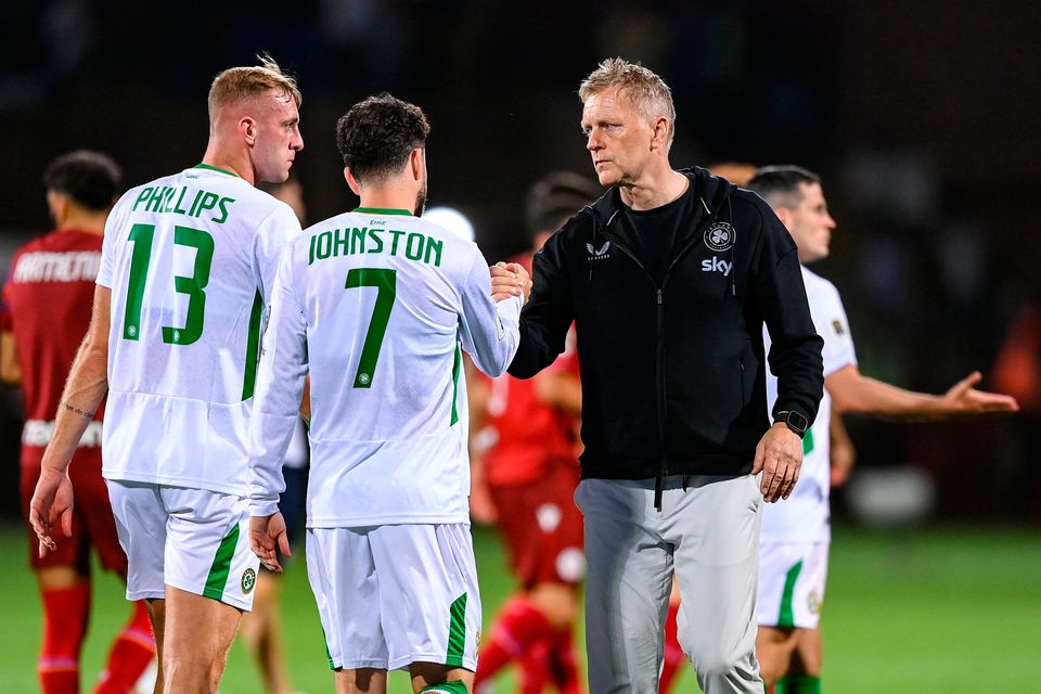 Ireland head coach Heimir Hallgrimsson, right, with Killian Phillips, left, and Mikey Johnston after Ireland's defeat in Yerevan