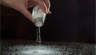 Sprinkling Salt on Table Concept