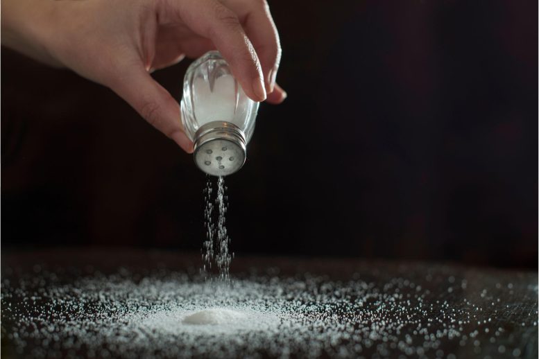 Sprinkling Salt on Table Concept