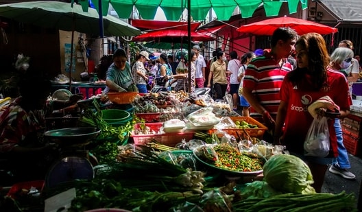 People shop at a market in Bangkok, Thailand, August 24, 2025. (REUTERS)