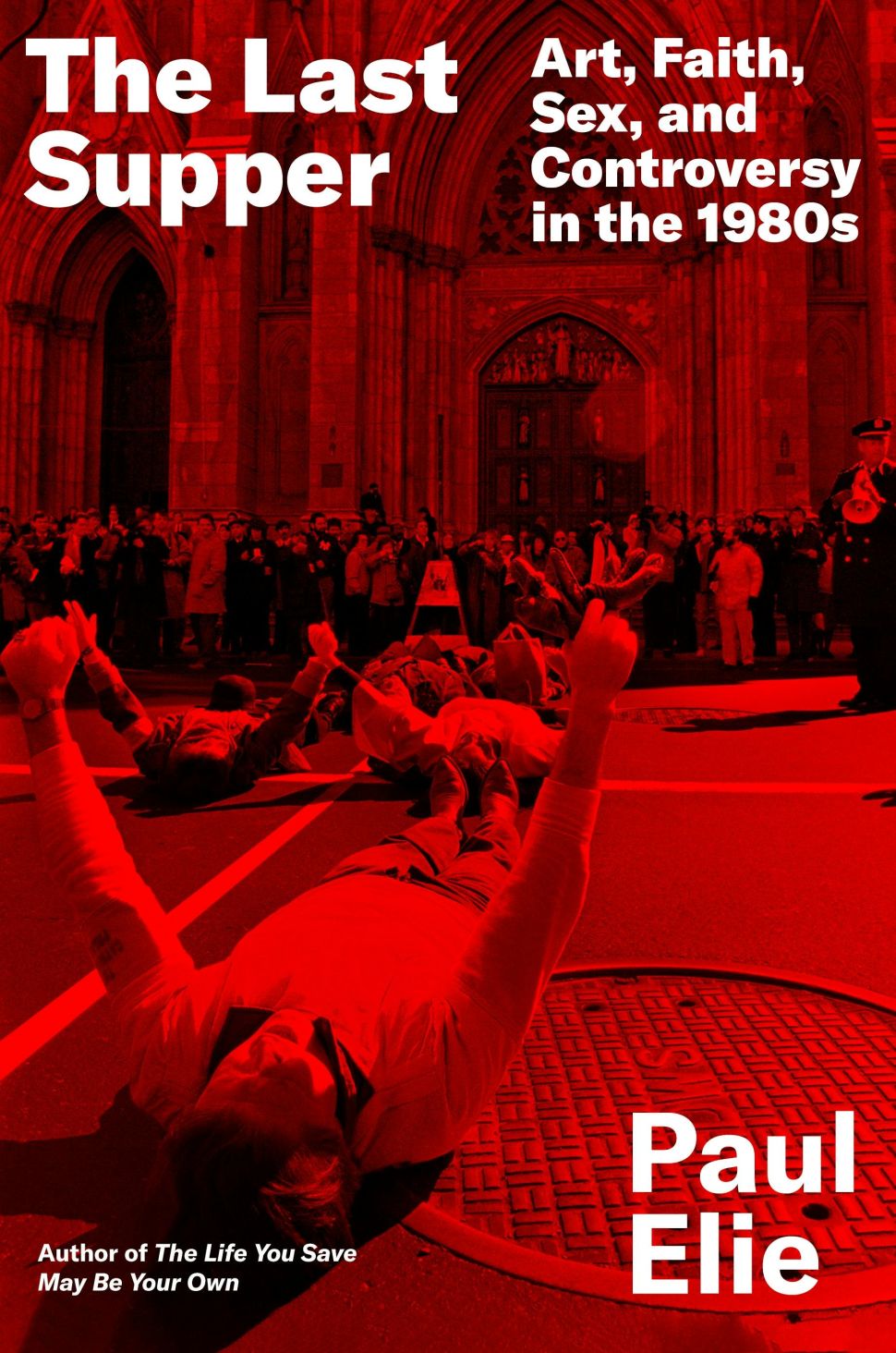An image of the book cover for The Last Supper by Paul Elie, designed in red with bold white type over a street protest scene in front of a cathedral.