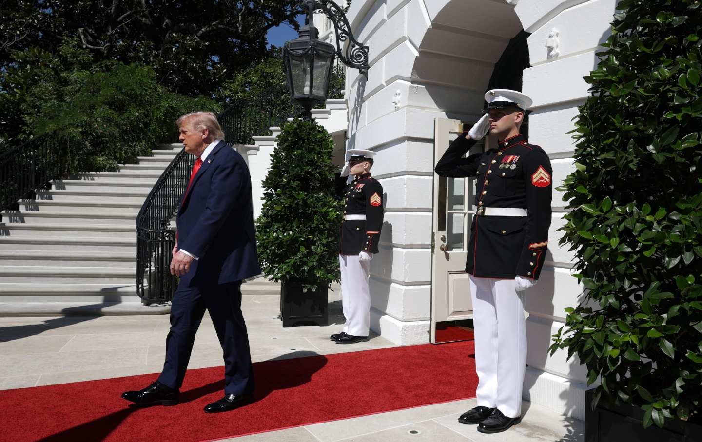 President Donald Trump walks outside the White House en route to a meeting with Polish President Karol Nawrocki.