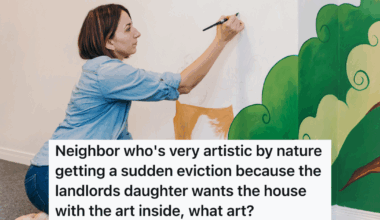 woman painting a mural on a wall