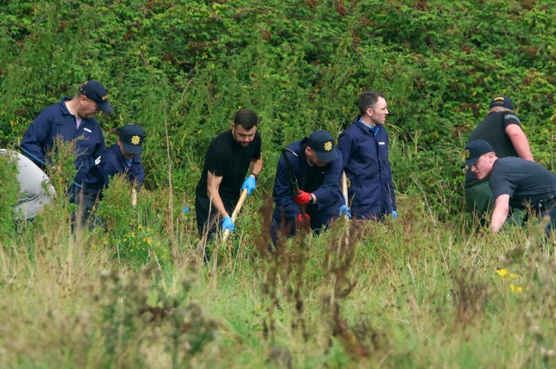 Gardaí at an area of open ground in Donabate, where the search for the remains of a child continues. Photograph: Colin Keegan/Collins Dublin