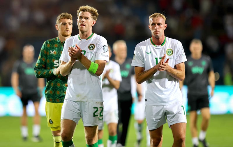 Ireland's Nathan Collins and Killian Phillips dejected after the match. Photograph: Ryan Byrne/Inpho