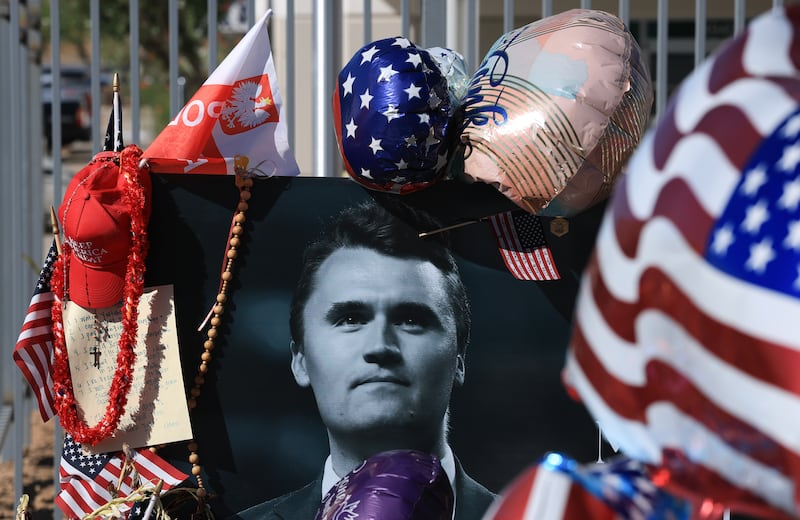 A photograph of Charlie Kirk is seen in a makeshift memorial outside the headquarters of Turning Point USA on Tuesday. Photograph by Joe Raedle/Getty Images