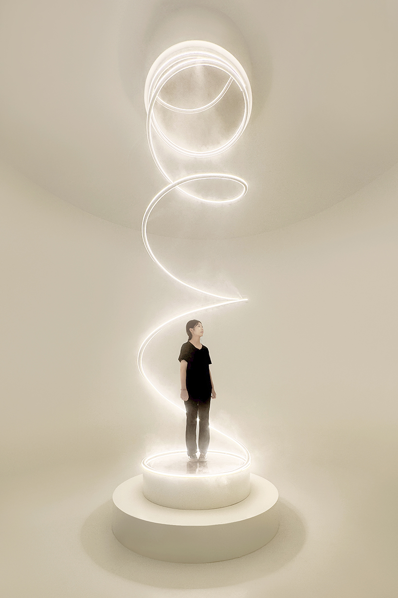 karolina halatek presents large-scale spiral installation of mist and light for lancôme