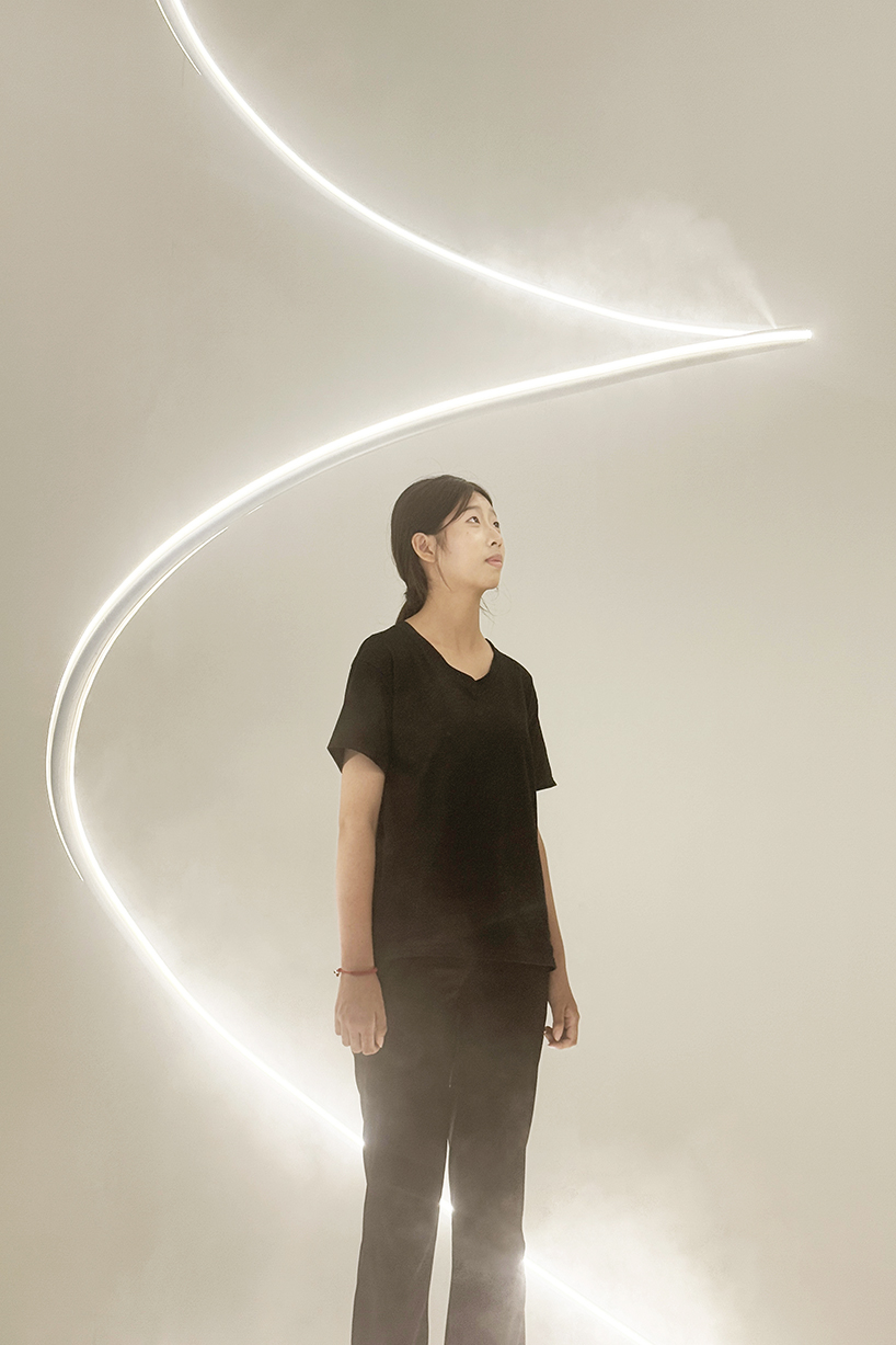 karolina halatek presents large-scale spiral installation of mist and light for lancôme