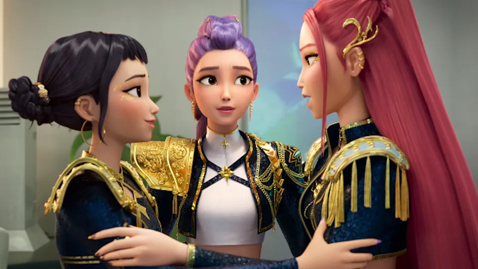  Zoey, Rumi and Mira embracing with black and gold costumes on in KPop Demon Hunters. 
