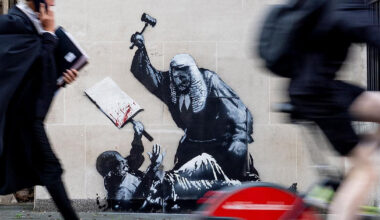 banksy returns with judge-and-protester mural at london's royal courts of justice