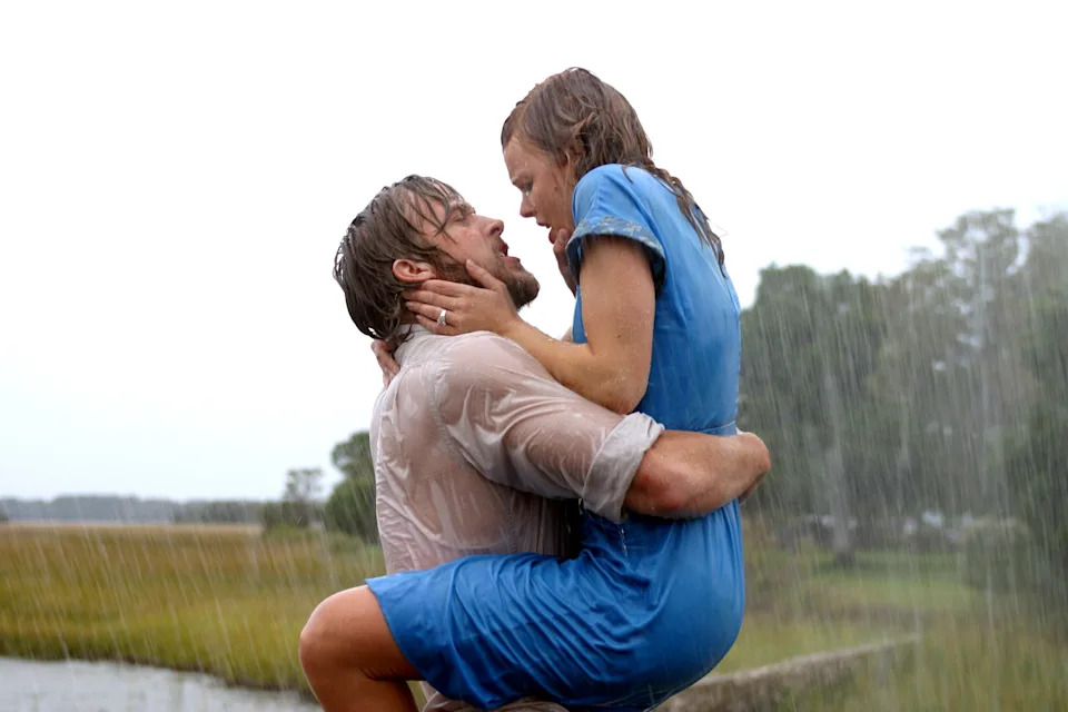 Couple embraces passionately in pouring rain, both soaked, conveying intense emotion, reminiscent of a dramatic movie scene
