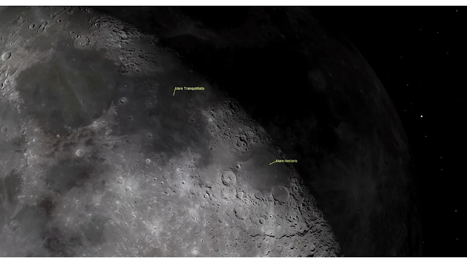 A close up of the moon's surface in space with labeled features like Mare Nectaris near craters on the moon