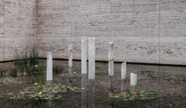 sculptures emerge from mies van der rohe's barcelona pavilion pond