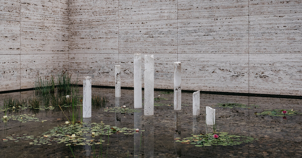 sculptures emerge from mies van der rohe's barcelona pavilion pond