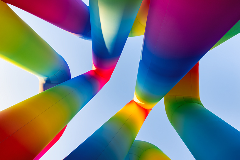 intertwined tubular forms shape inflatable rainbow labyrinth by cyril fancelin in grand rapids