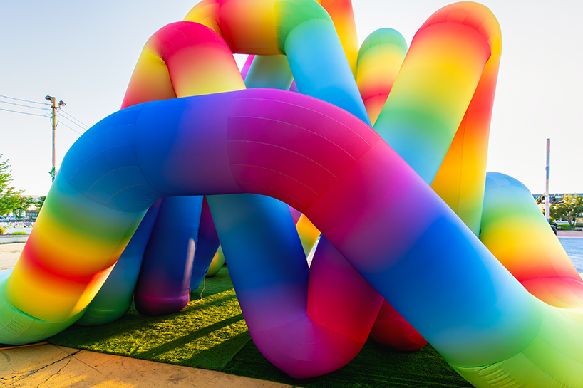intertwined tubular forms shape inflatable rainbow labyrinth by cyril fancelin in grand rapids