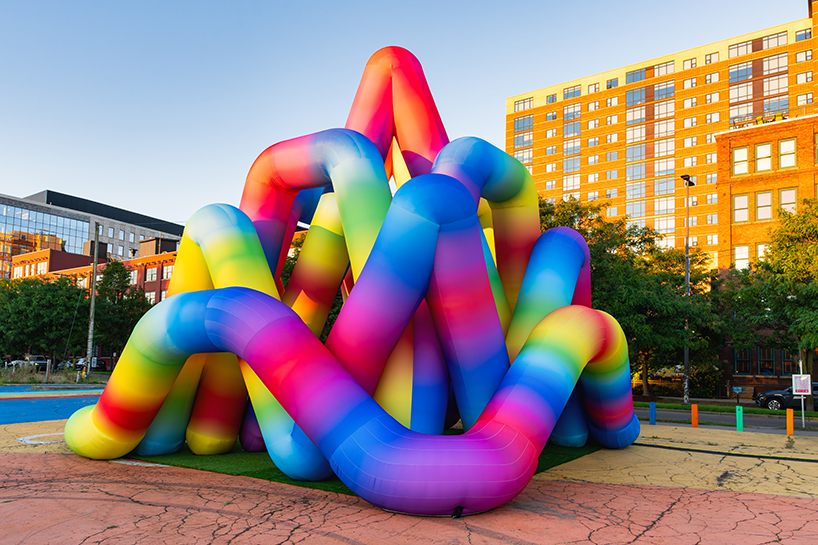 intertwined tubular forms shape inflatable rainbow labyrinth by cyril fancelin in grand rapids