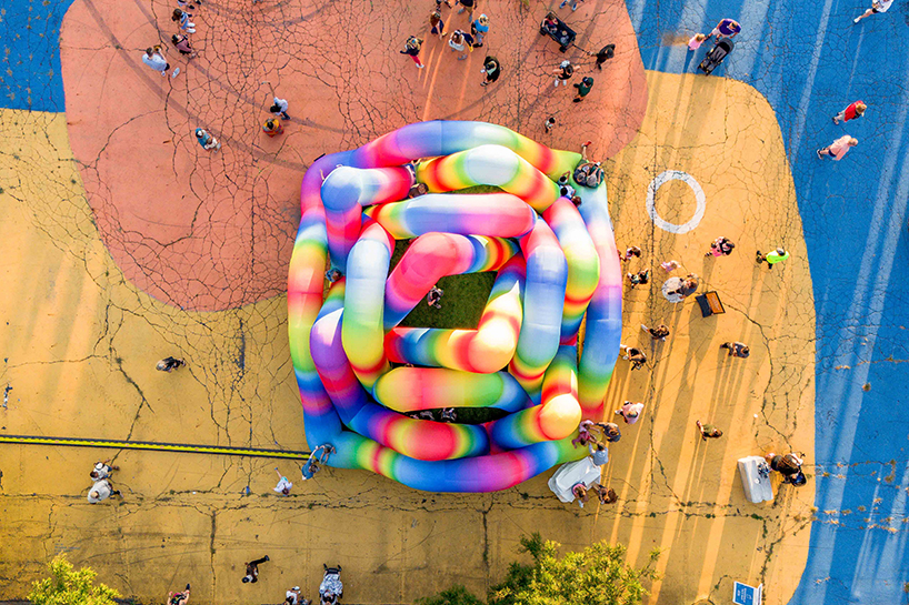 intertwined tubular forms shape inflatable rainbow labyrinth by cyril fancelin in grand rapids