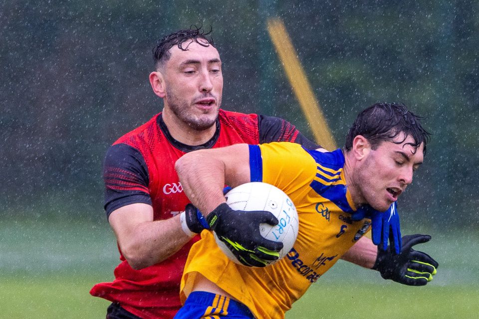 Mike Breen of Beaufort in action against Paudie Clifford of Fossa during their Kerry Petroleum Intermediate Club Football Championship quarter final in Beaufort on Sunday. Photo by Tatyana McGough