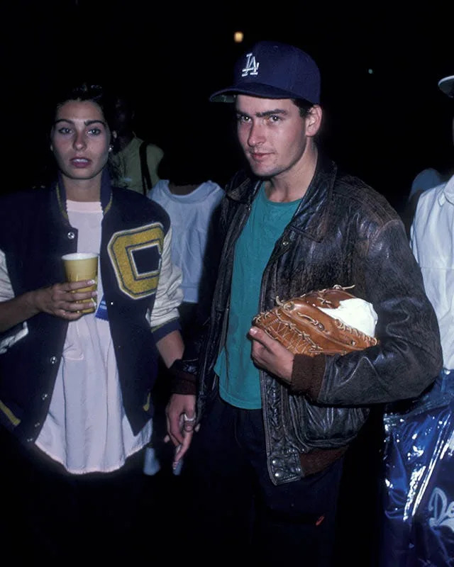 Dolly Fox and Charlie Sheen holding hands during their relationship in the '80s