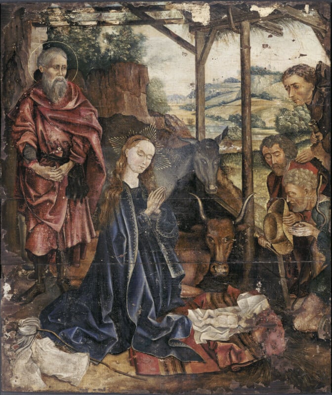 A Renaissance nativity scene shows Mary praying over baby Jesus in a manger, Joseph nearby, with an ox and donkey behind them. Three men look on, and a landscape is visible in the background.