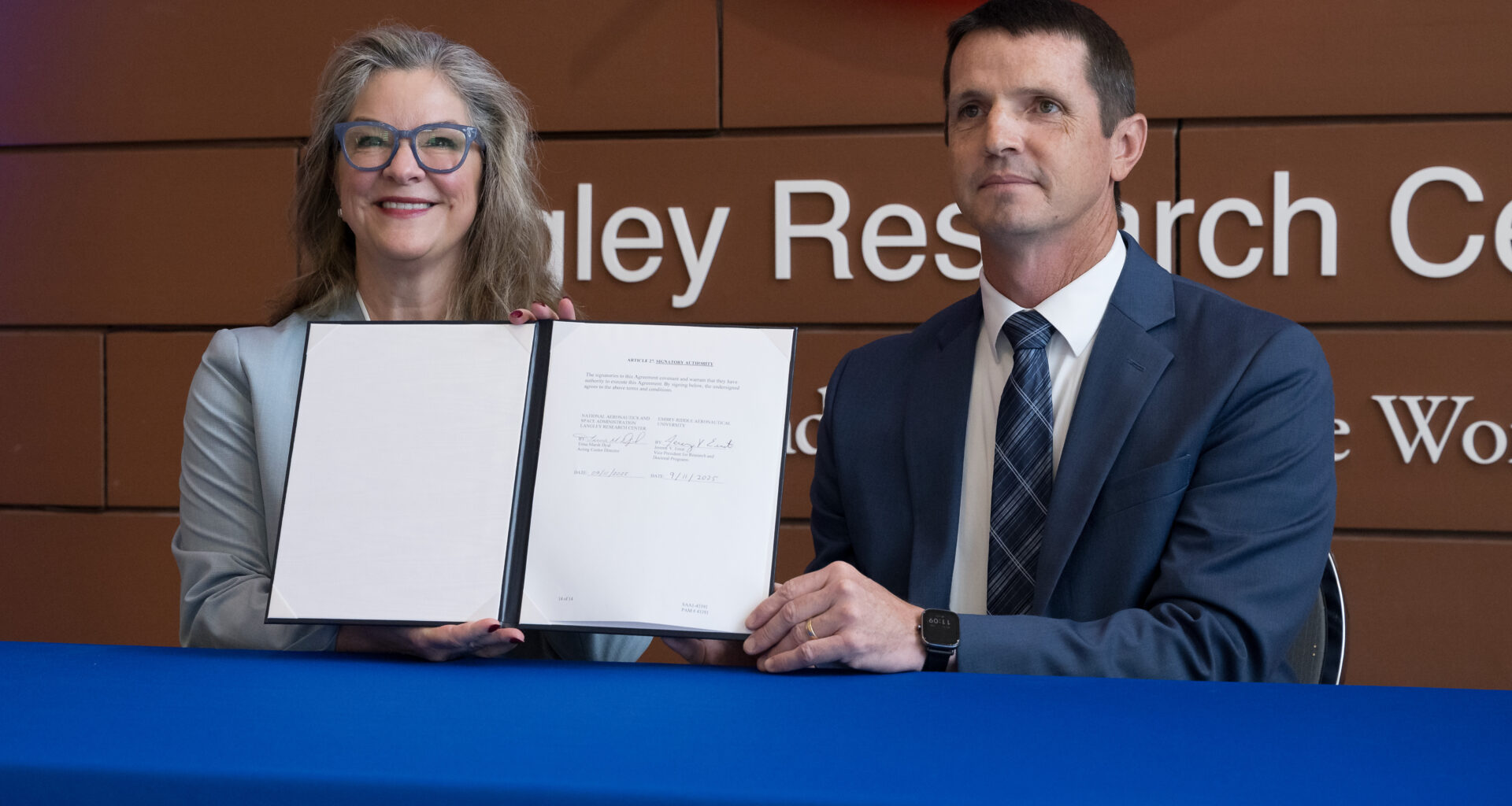 NASA’s Langley Research Center Acting Director Dr. Trina Marsh Dyal, left, and Dr. Jeremy Ernst, vice president for Research and Doctoral Programs at Embry-Riddle Aeronautical University, complete the signing of a Space Act Agreement during a ceremony held at NASA Langley in Hampton, Virginia on Thursday, Sept. 11, 2025