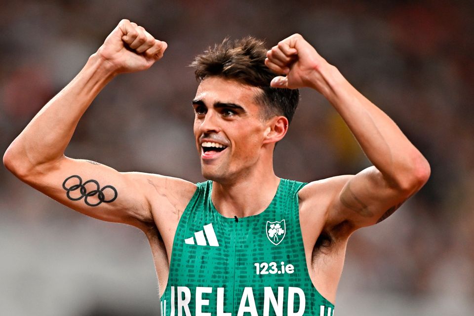 Andrew Coscoran of Ireland celebrates after finishing fifth in the men's 1500m semi-finals