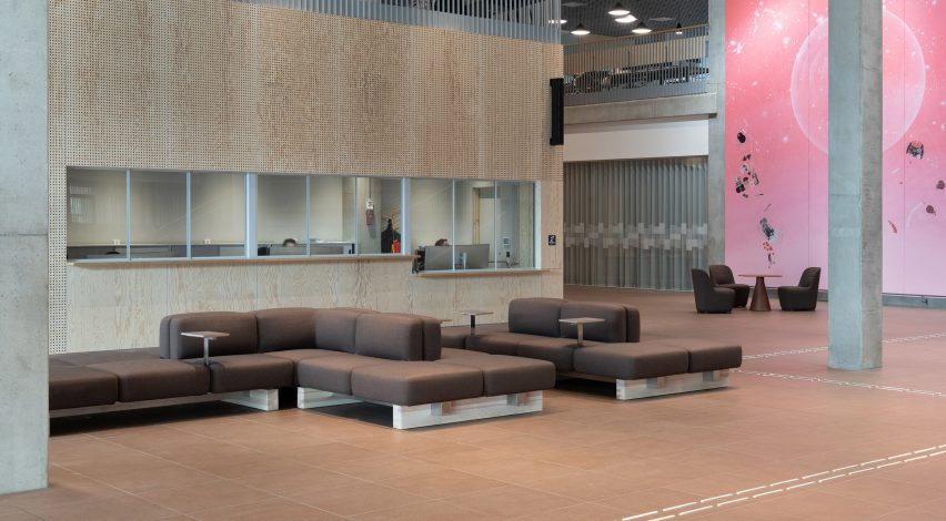 University lobby with brown sofas